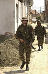 Kosovo trip
Specialist Travis Surprise a members of the 40th Combat Engineers stationed at Camp Monteith, walks a foot patrol through the town of Gjilan.