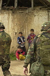 Kosovo trip
Ethnic Albanian boys watch an American patrol pass by in the town of Vitina.