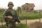 Kosovo trip
1st Lt. Jeff DiMarzio of Bridgewater, stationed in Kosovo with the 325th Airborne Infantry Regiment, stands in front of a Serb home that was distroyed by a bomb in the town of Vitina.